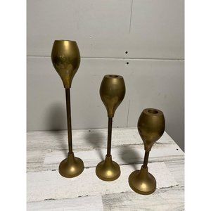 Set of three solid brass candlesticks